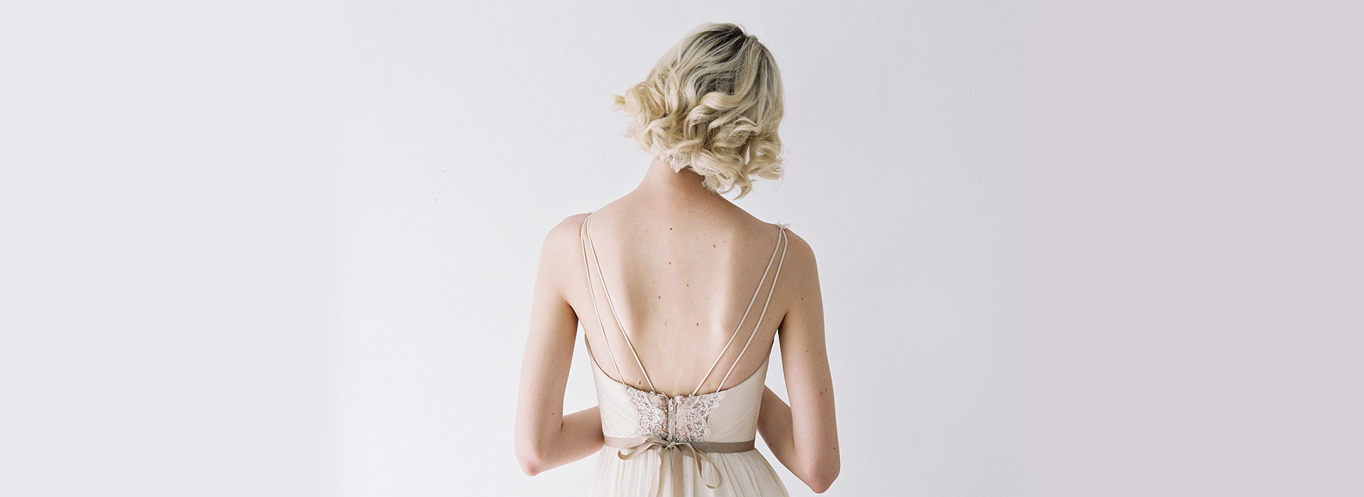 Woman in a dress facing away.